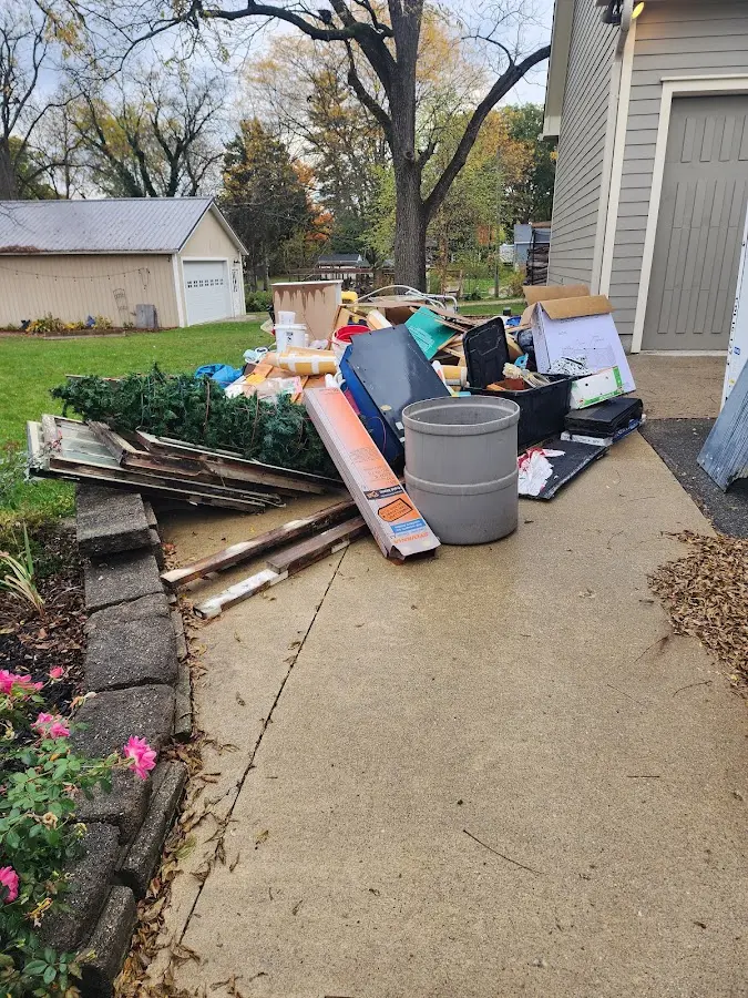 Dumpster being loaded with debris for Roofing Dumpster Rental in Clairton